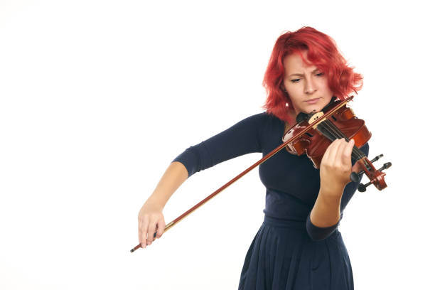 istock Musician beautiful young woman playing violin 856560474