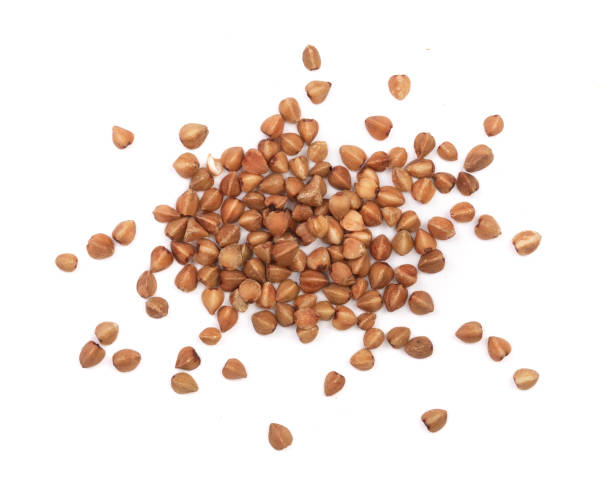 istock buckwheat grain isolated on white background close up. Top view 856560746