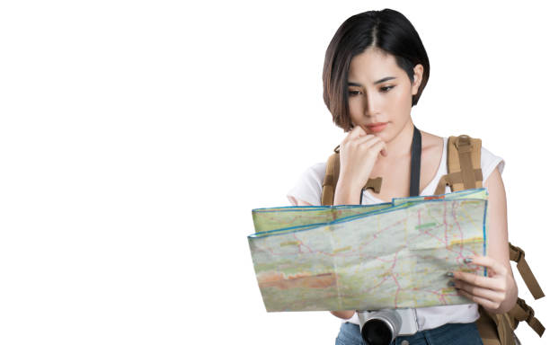 istock Asian woman she are viewing the map she was planning and thinking.studio white background 856561154
