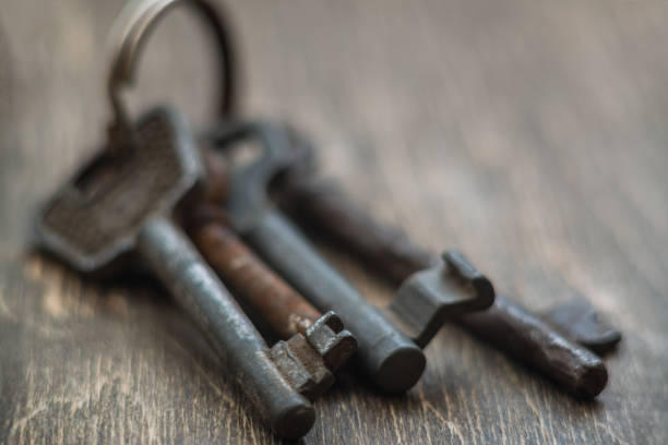 istock Old key on a wooden backgroundd 856562218