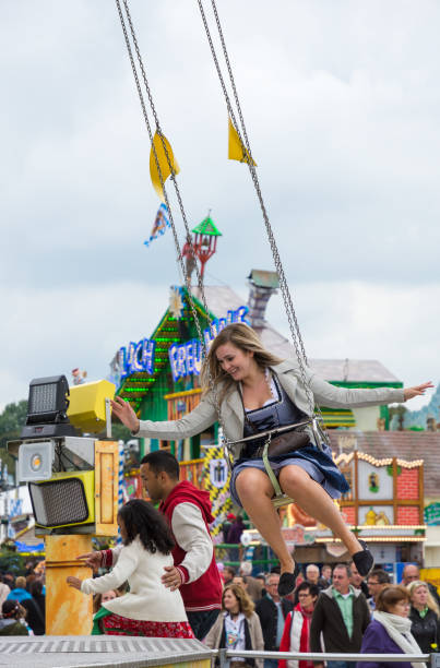 traditional chairoplane at oktoberfest in munich - amusement park oktoberfest munich chain swing ride imagens e fotografias de stock