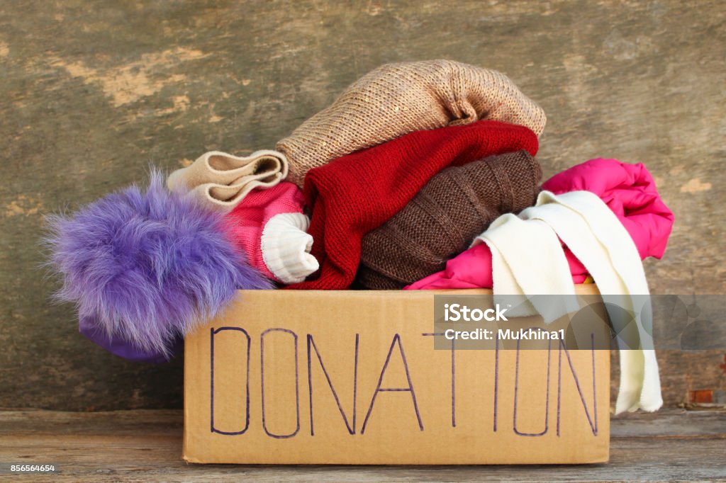 Donation box with clothes. Charitable Donation Stock Photo