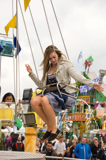 traditional chairoplane at oktoberfest in munich - amusement park oktoberfest munich chain swing ride imagens e fotografias de stock