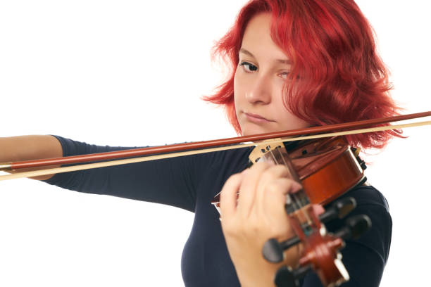 istock Beautiful young woman playing the violin 856564752