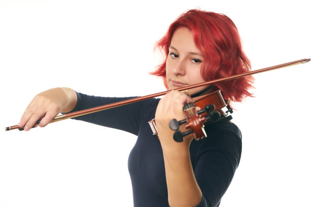 istock Beautiful young woman playing the violin 856567728
