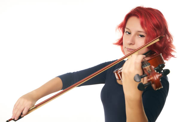 istock Beautiful young woman playing the violin 856568968