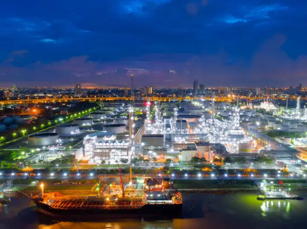 Aerial view of twilight of oil refinery ,Shot from drone of Oil refinery and Petrochemical plant at dusk , Bangkok, Thailand