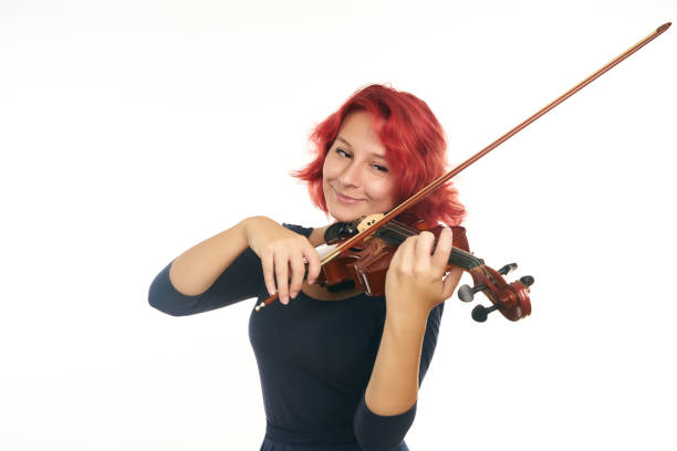 istock Musician young woman playing violin 856572052