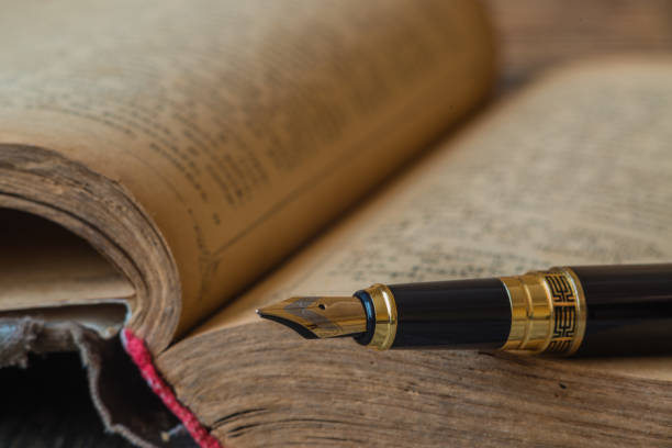 istock Old book on a wooden background 856575506