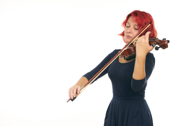 istock Musician beautiful young woman playing violin 856576268