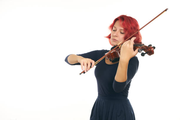 istock Musician beautiful young woman playing violin 856578872
