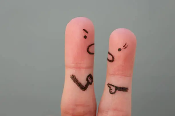 Fingers art of couple in quarrel. Man and woman swear.