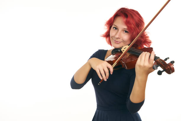 istock Musician young woman playing violin 856581778