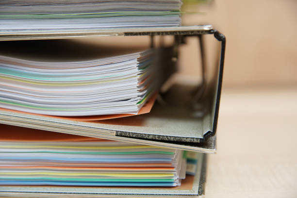 istock pile of office folder on the wooden table 856581800
