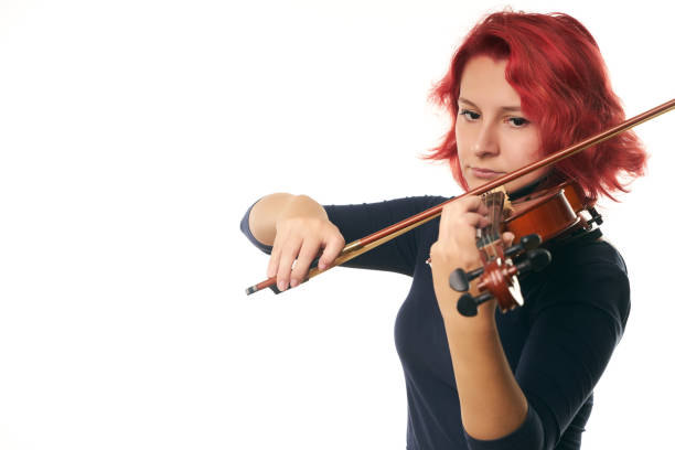 istock Violinist young redhead woman and violin 856582638