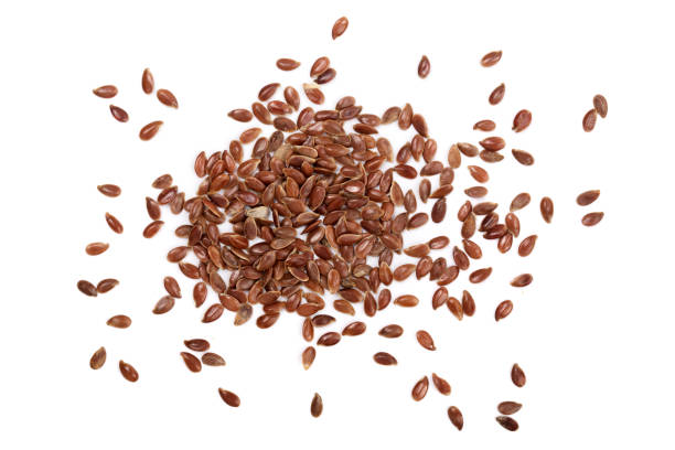 istock flax seeds isolated on white background. Top view 856585584