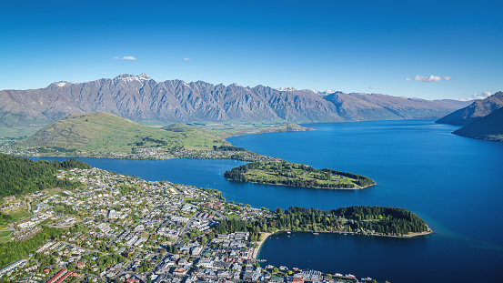 Aerial panoramic view of the city of Queenstown in the south-west of the South Island of New Zealand on a sunny summer day. Queenstown, Otago, South Island, New Zealand, Oceania.