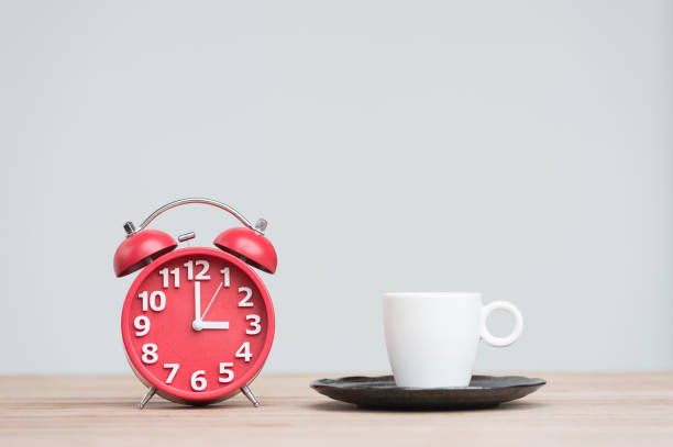 istock time for tea, retro alarm clock and tea cups 856592966
