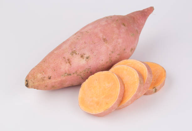 istock Raw sweet potato isolated on the white. 856593712