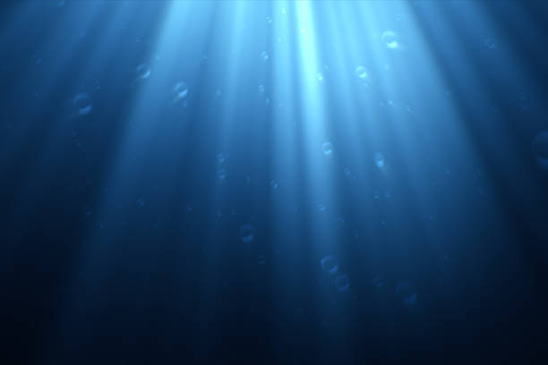 istock Underwater scene with air bubbles floating up and sun shining through the water 3d illustration 856593850