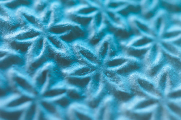 istock Light blue toilet paper surface macro view, stars decorated texture. 856600936