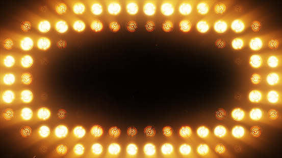 The wall of bright orange incandescent lamps lights up along the pattern seamless loop
