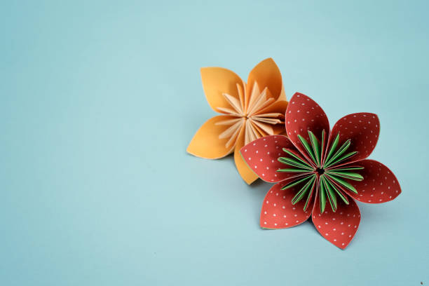 Flower origami with blue background
