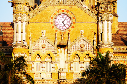 Chhatrapati Shivaji Maharaj Terminus (CSMT), formerly Victoria Terminus in details. Sunset time - bright colors. Historic railway station and a UNESCO World Heritage Site.
