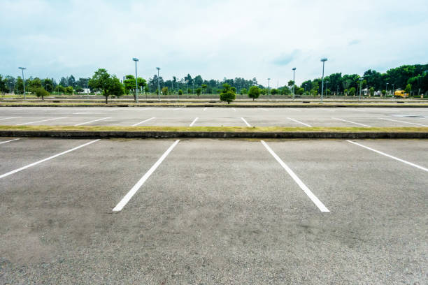istock Empty parking with white line mark on rainy cloudy day 856624850