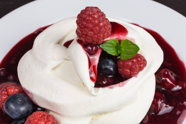 istock pavlova meringue with berries 856624860