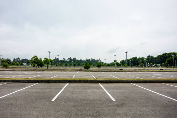 istock Empty parking with white line mark on rainy cloudy day 856624904
