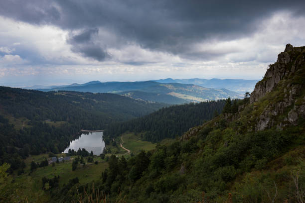 View of a lake in a deep valley in the Vosges mountains in France stock photo