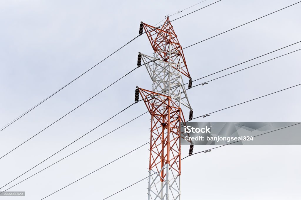 Old electrical tower in the clouds Blue, Cable, Cloud - Sky, Color Image, Day Blue Stock Photo