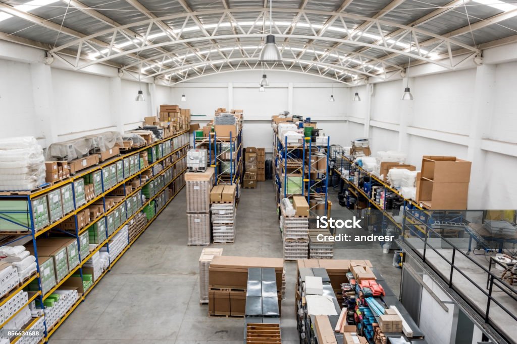 Distribution warehouse Distribution warehouse full of boxes - freight transportation business concepts World Trade Organization Stock Photo