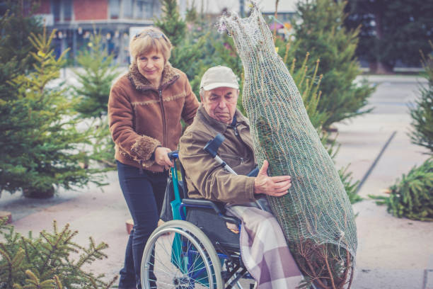 istock Senior Father and Daughter Shopping Christmas Tree 856638384