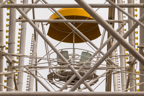 Girder of Ferris wheel and cabin seen through it