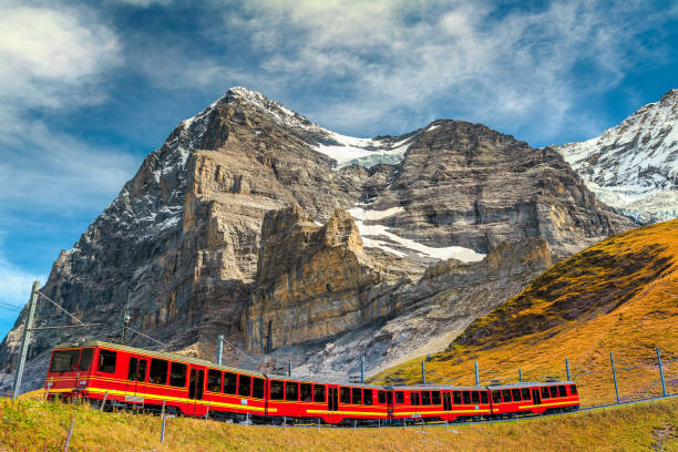 electric tourist train and famous eiger peak, bernese oberland, switzerland - jungfrau photography landscapes nature imagens e fotografias de stock