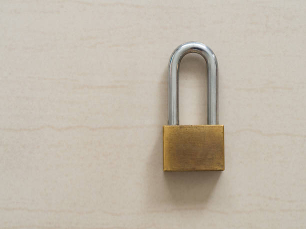 istock Gold padlock locked on floor. Concept of secure and safety lock. 856644992