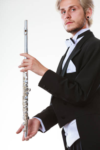 istock Male flutist wearing tailcoat holds flute 856645046