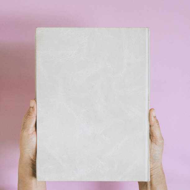 top view mock up book on hand and magazine text
