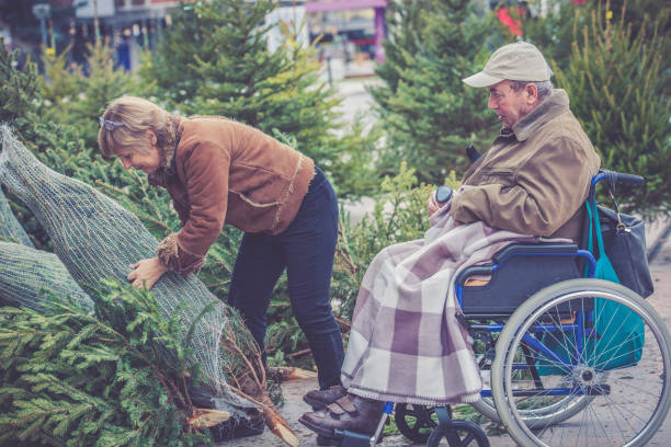 istock Senior Father and Daughter Shopping Christmas Tree 856646048