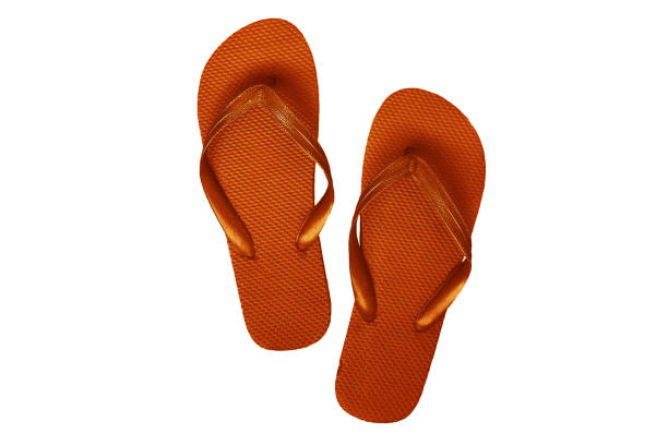 istock Yellow-orange rubber flip flops, isolated on a white background 856650026