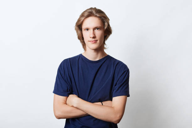 istock Horizontal portrait of handsome guy with specific appearance, keeping his hands crossed, looking with confidence into camera, isolated over white background. Male freelancer or manager going for work 856652612