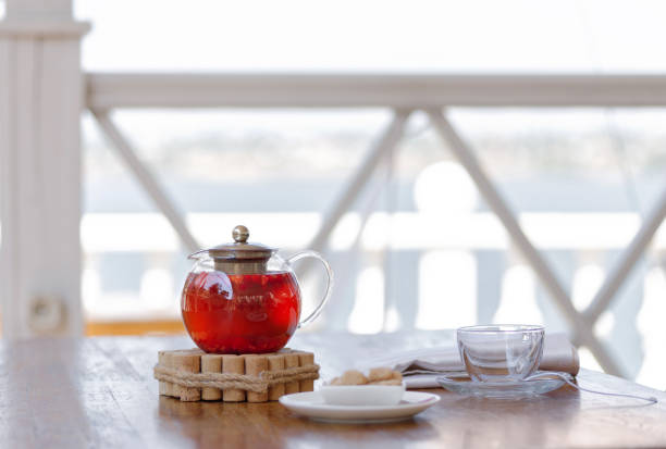 istock A hot beverage from juicy strawberries and red currant on a blurred white background. A beautiful tea composition. Copy space. 856652998