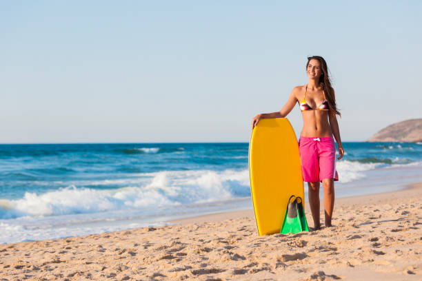 istock Girl with her bodyboard 856653808