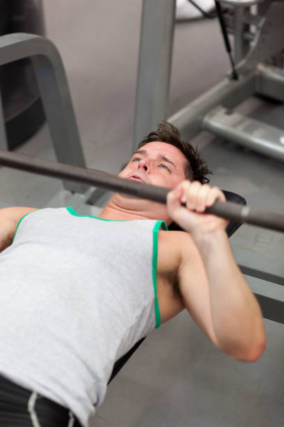 istock Muscular man working out with dumbbells 856653850