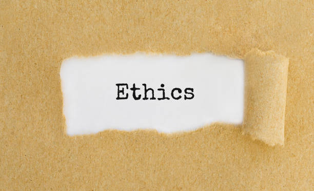 istock Text Ethics appearing behind ripped brown paper. 856656008