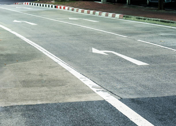 istock Arrow on the road and white color 856656142
