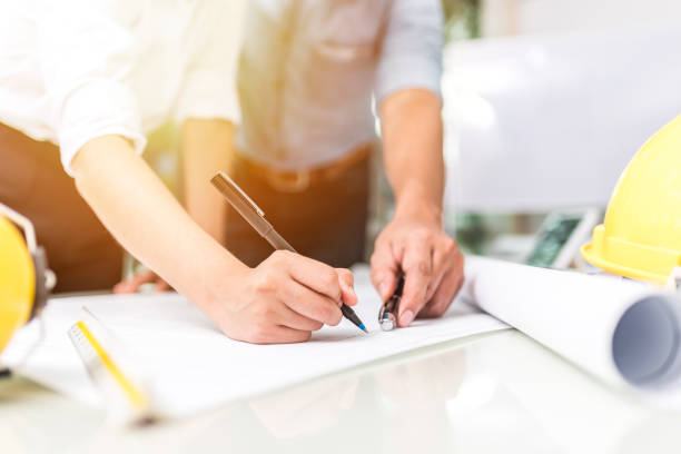 istock hand of business people pointing at document during team meeting 856656742