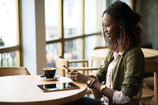 istock Beautiful African woman using mobile phone. 856659700